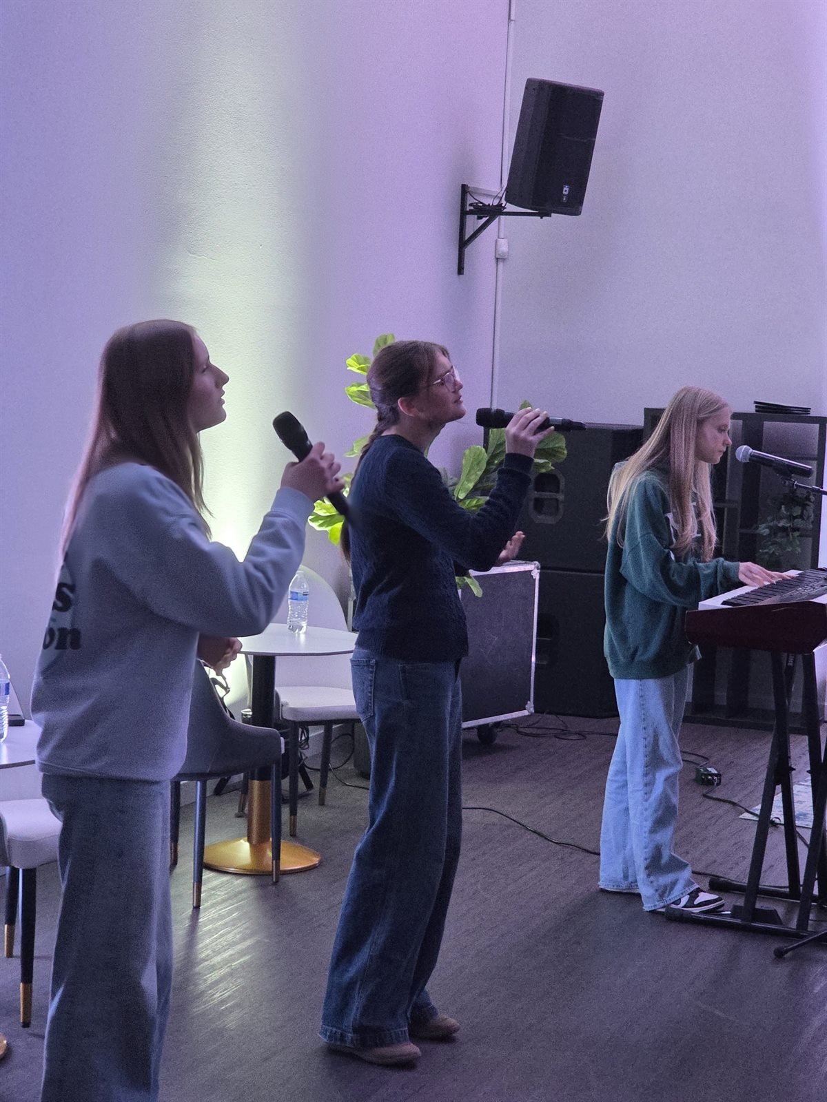 Students leading worship on a Tuesday night